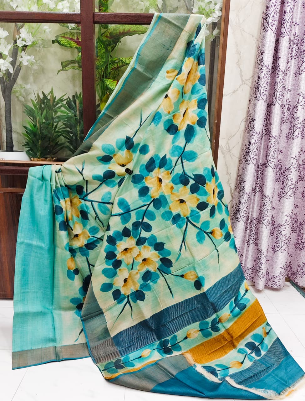 Hand-Painted Zari Border Gachi Tussar Silk Saree – Aqua Blue Base with Yellow Floral Design